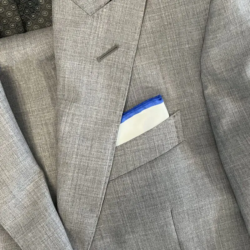 A suit jacket with a pocket square in it.