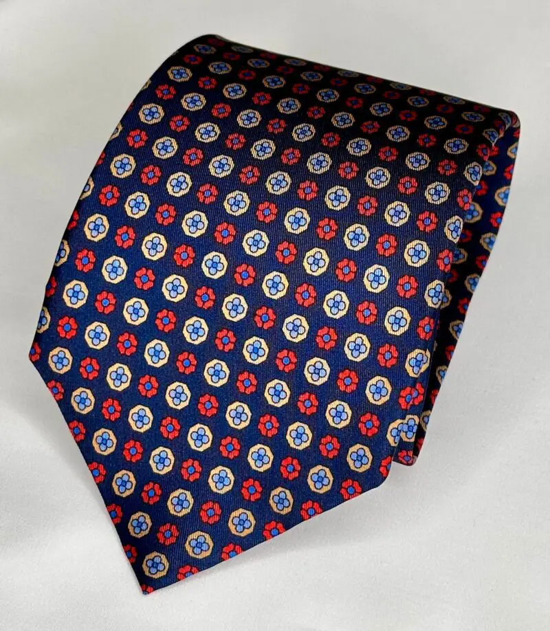 A red, white and blue tie with stars on it.