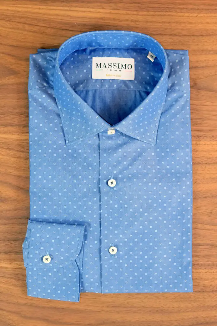 A blue shirt with white dots on it