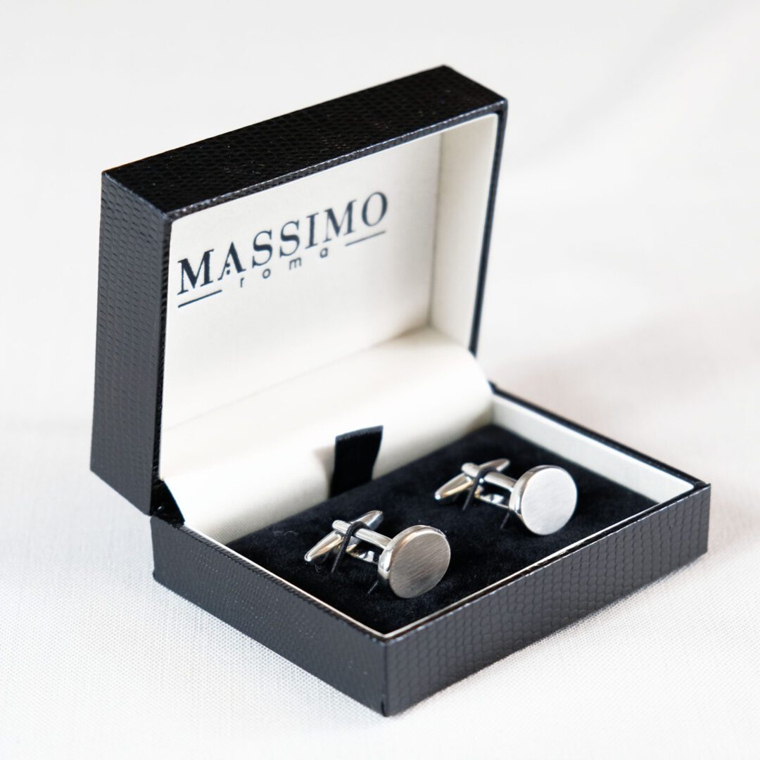 A box with two cufflinks in it