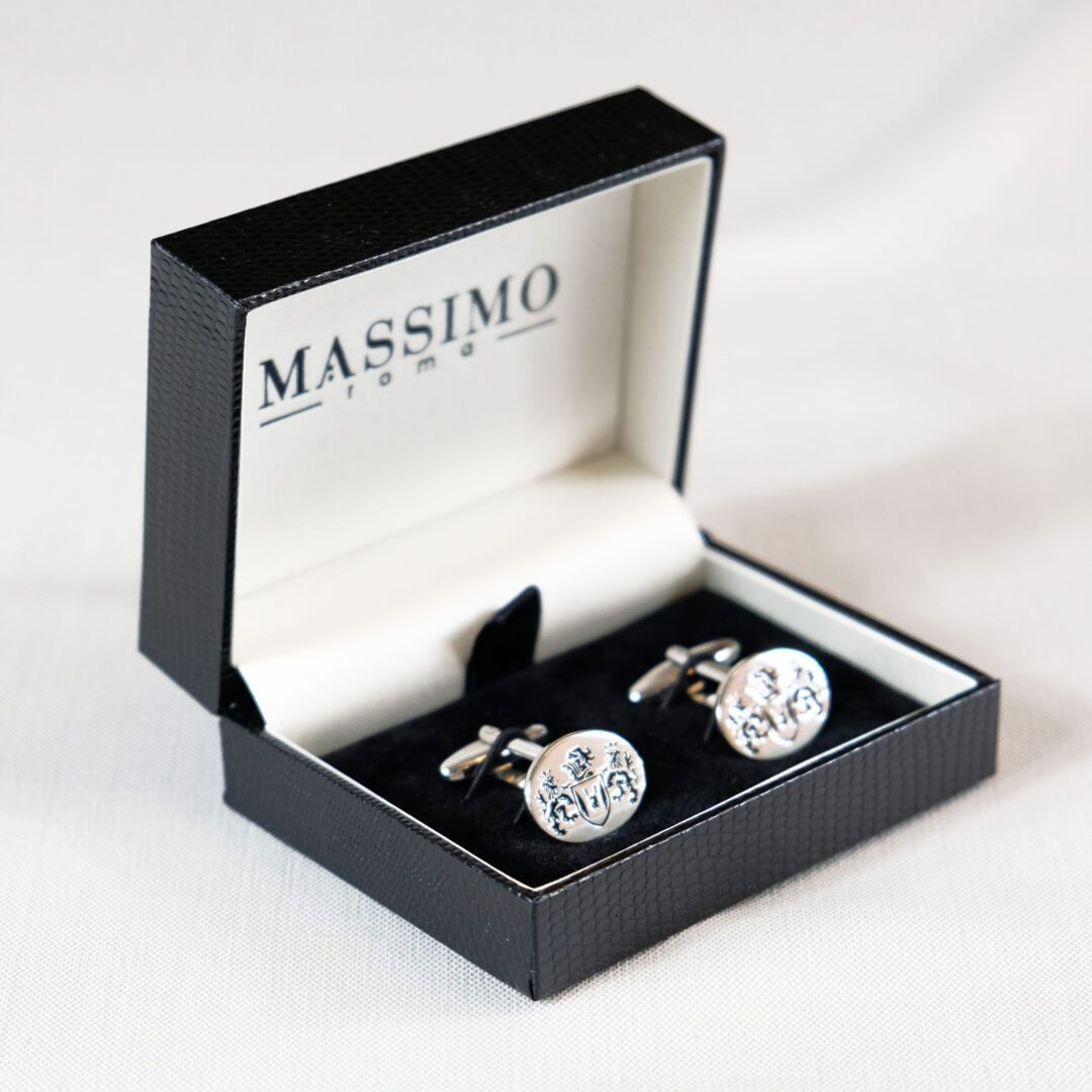 A pair of cufflinks in a box.