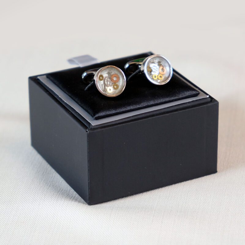 A pair of cufflinks in a black box.