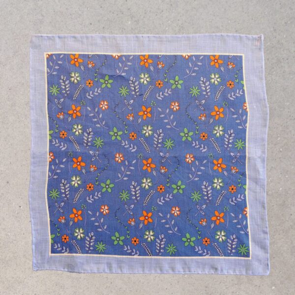 A blue square with flowers on it