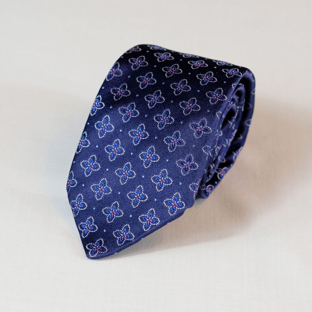 A blue tie with a pattern on it