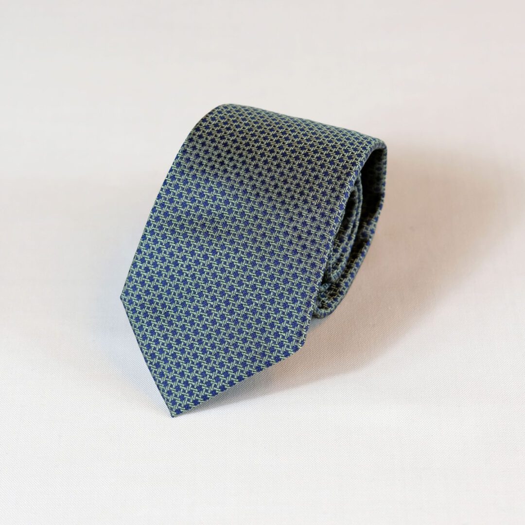 A blue tie with white squares on it