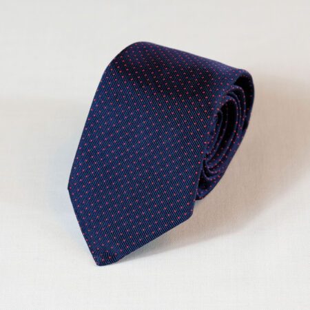 A blue tie with red squares on it