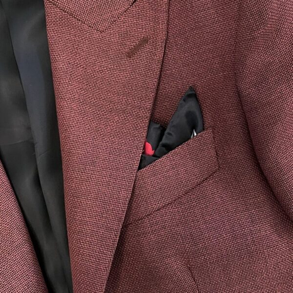 A close up of the pocket square on a suit