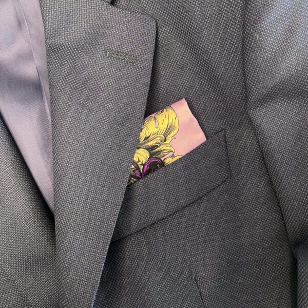 A close up of the pocket square in someone 's suit