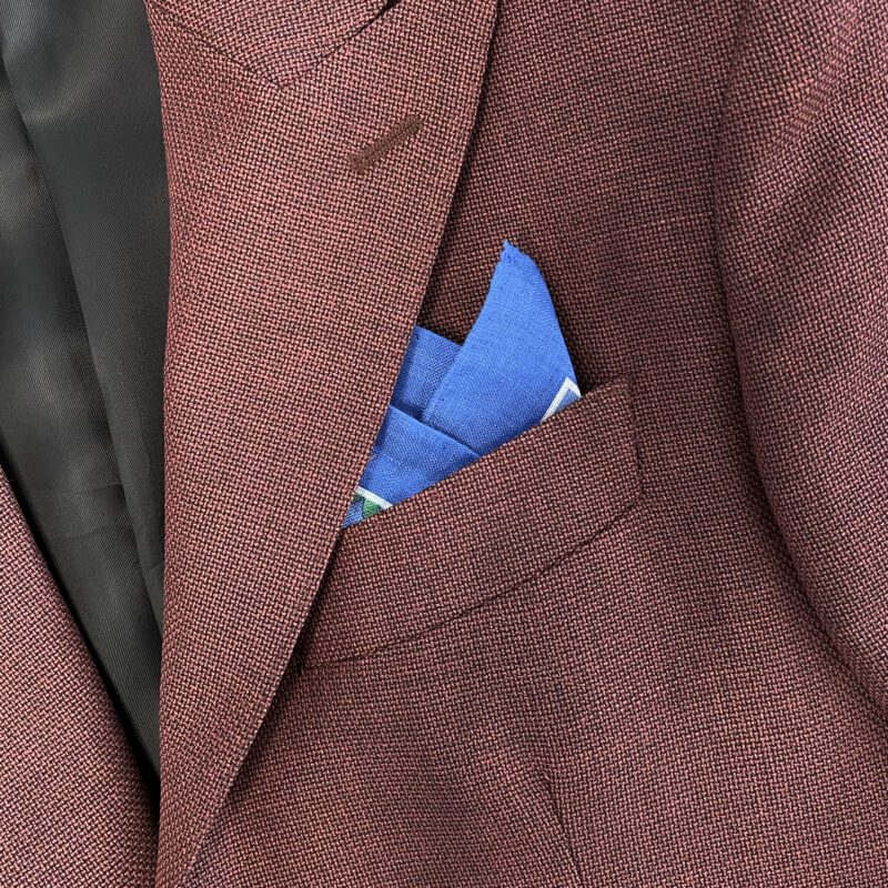 A close up of the pocket square in someone 's suit