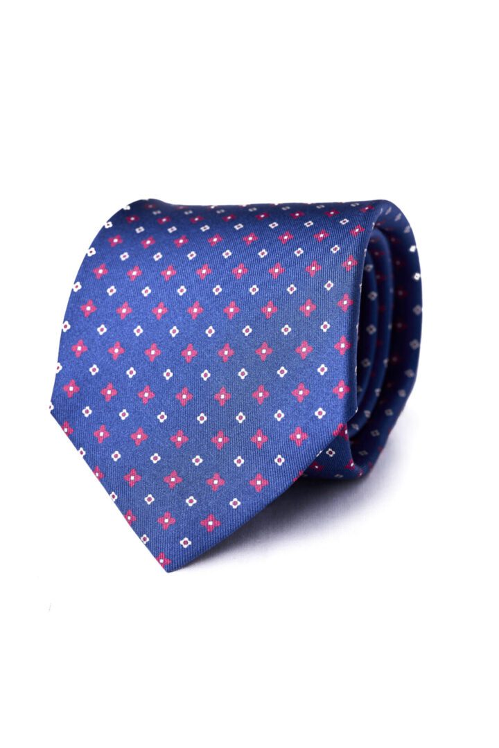 A blue tie with red and white squares on it