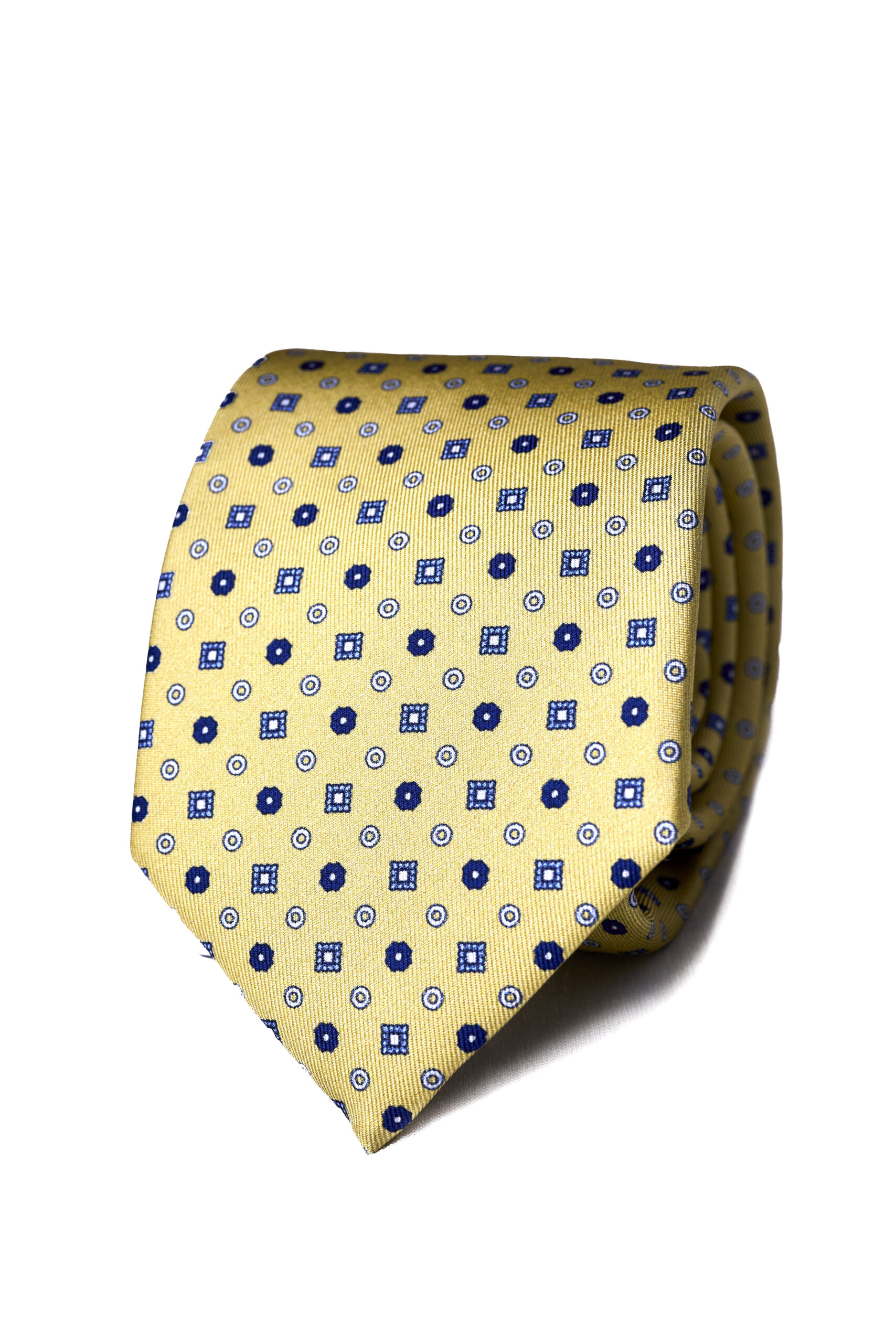 A yellow tie with blue and white squares on it