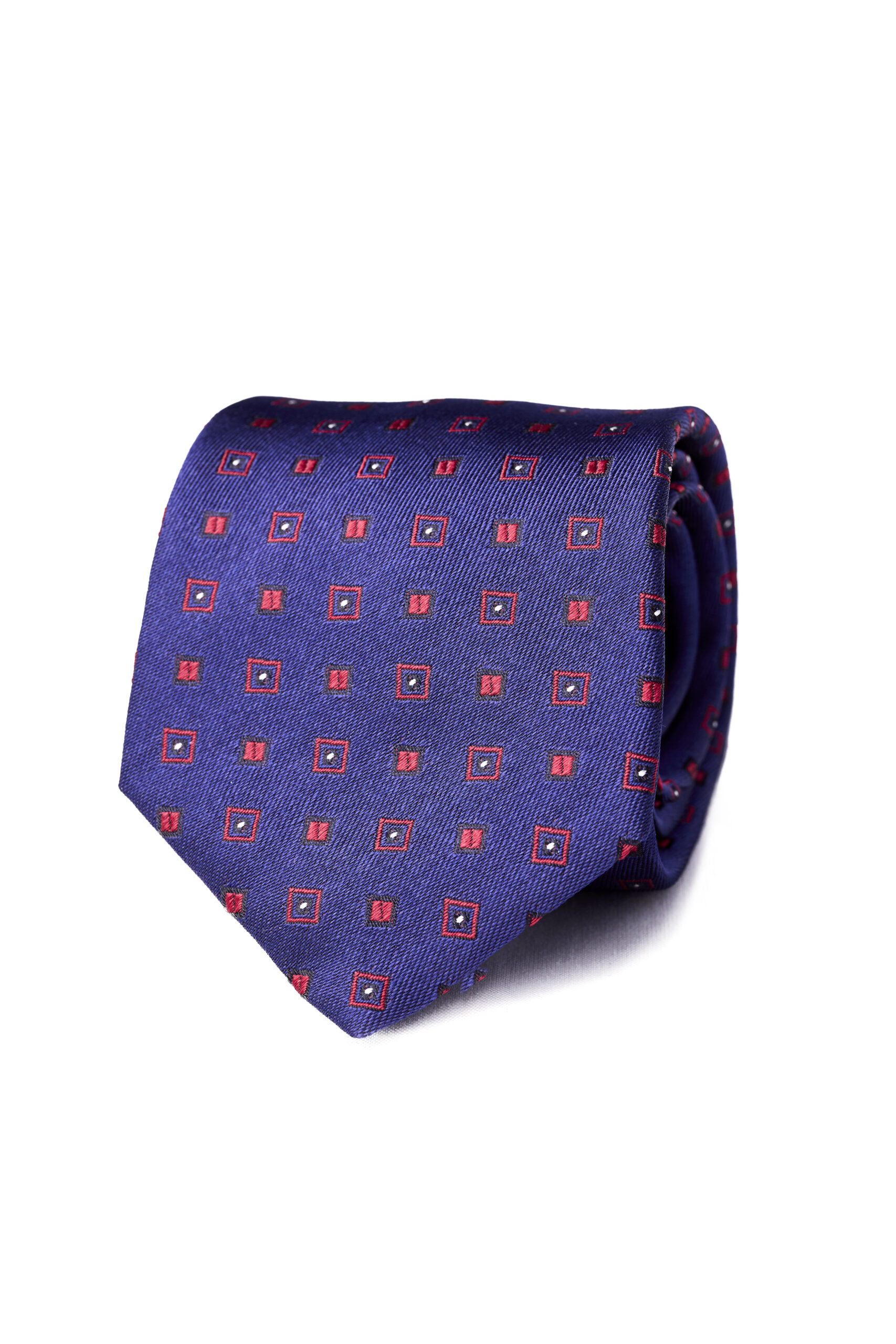 A blue tie with red squares and dots on it