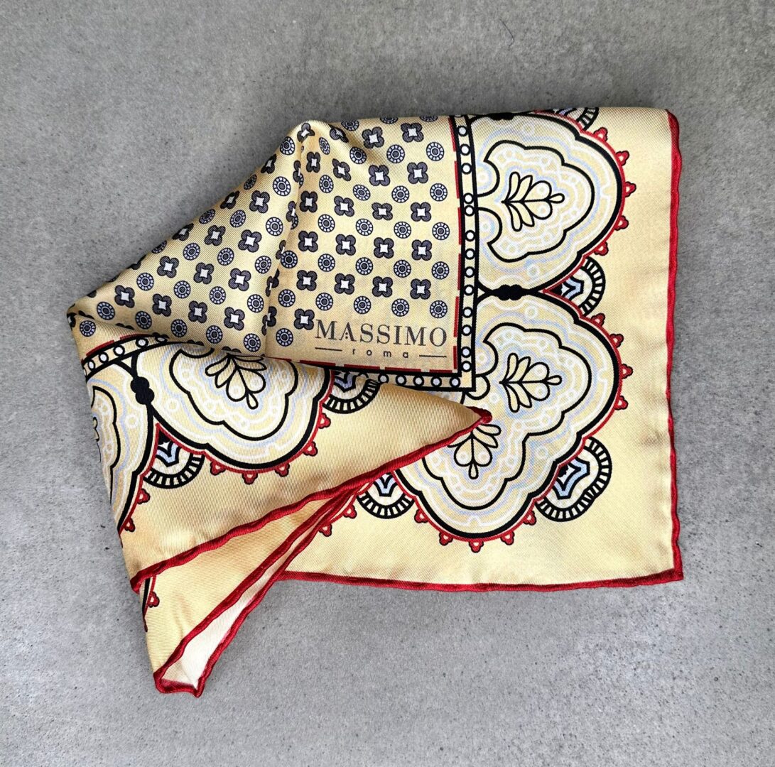A folded handkerchief with a pattern on it.