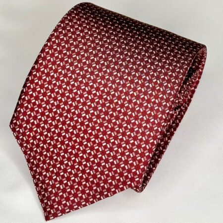 A red tie with white crosses on it.