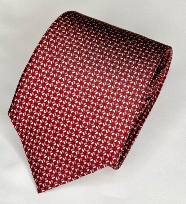 A red tie with white crosses on it.