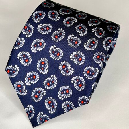 A blue tie with red and white paisley design.