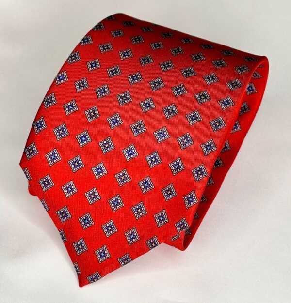 A red tie with blue squares on it.